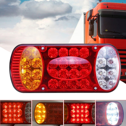 Red, yellow, and clear LED trailer tail light with oval yellow outer lens and red center