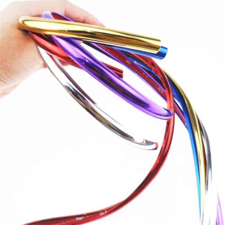 Hand holding glossy reflective electroplating wheel decorative strips in mixed colors