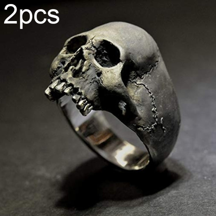 Silver-tone skull ring featuring hollow eye sockets and etched cracked skull