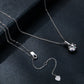 Sterling silver zircon pendant necklace with round charm, chain, and heart tag clasp