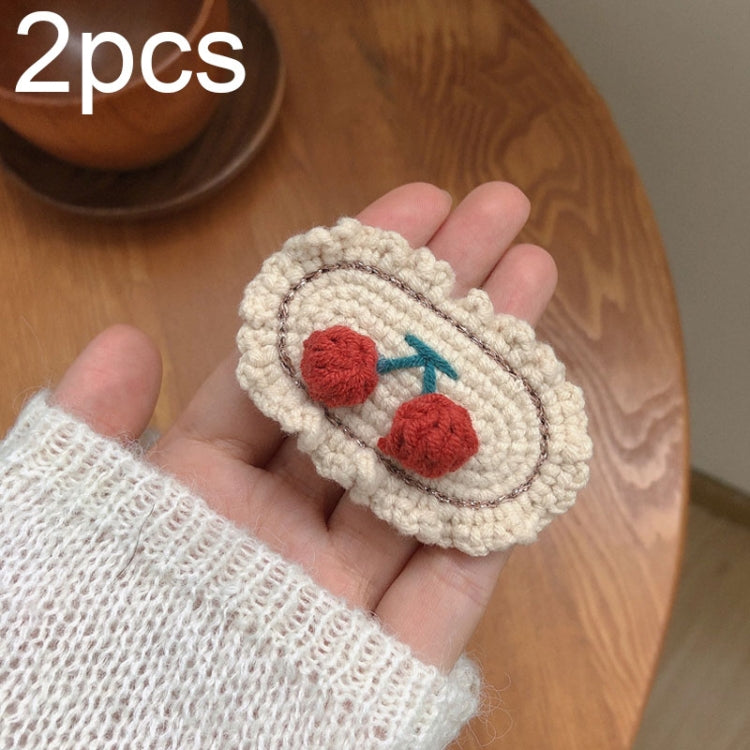 Cream knit oval hair clips with red cherry smiley face