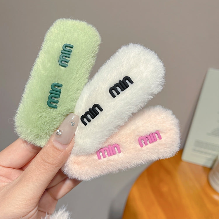 Plush hair clips with 'mm' embroidery in mint, white, and pink