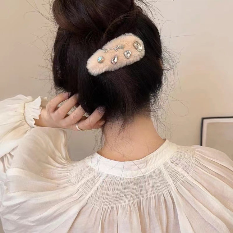 Beige plush face hair clip with rhinestone eyes and silver bow