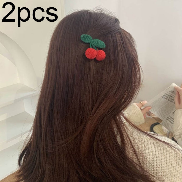 Cherry knit hair clip with green leaf detail