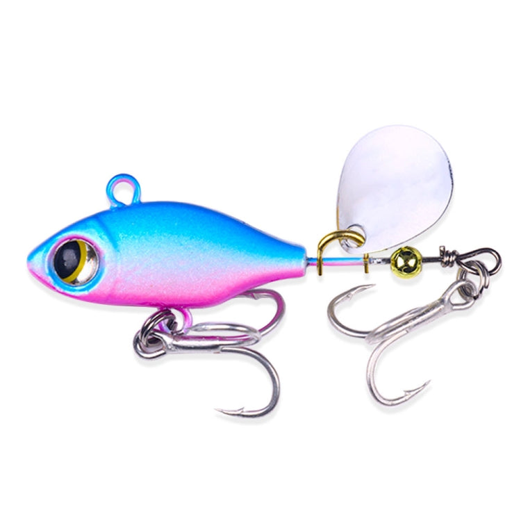 Sequin fishing lure with blue/pink body, white spinner blade, twin treble hooks