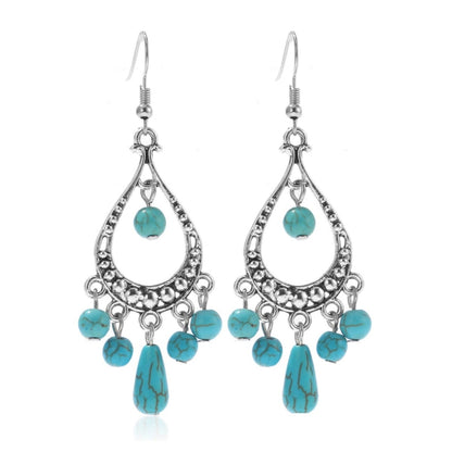 Turquoise drop chandelier earrings with teardrop fringe and silver-tone hooks