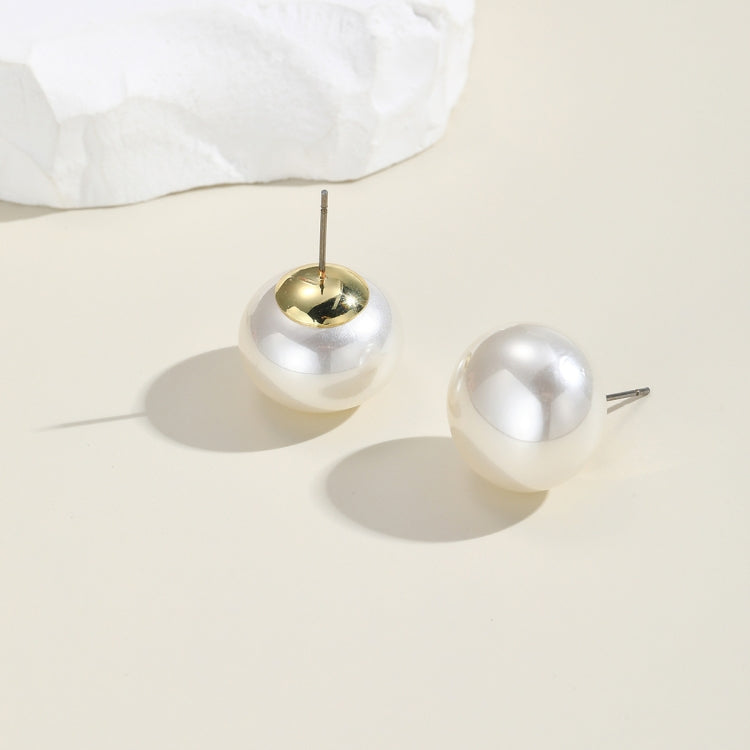 White pearl ball stud earrings with gold-tone metal posts and domed round fronts