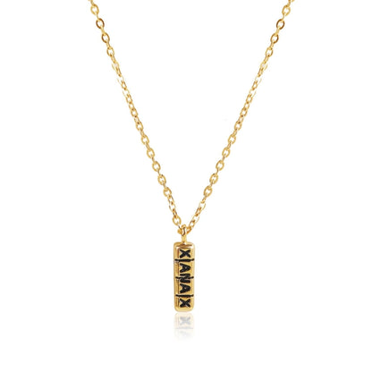 Gold tone chain necklace with engraved vertical bar pendant at the collarbone