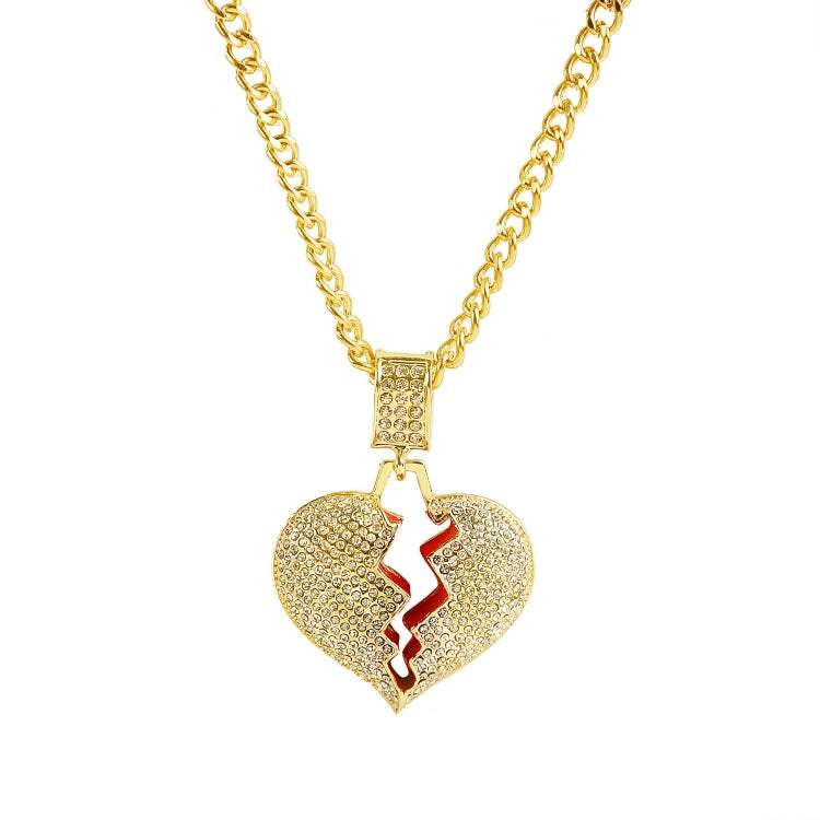 Gold chain necklace with heart pendant with red cutout and rhinestones