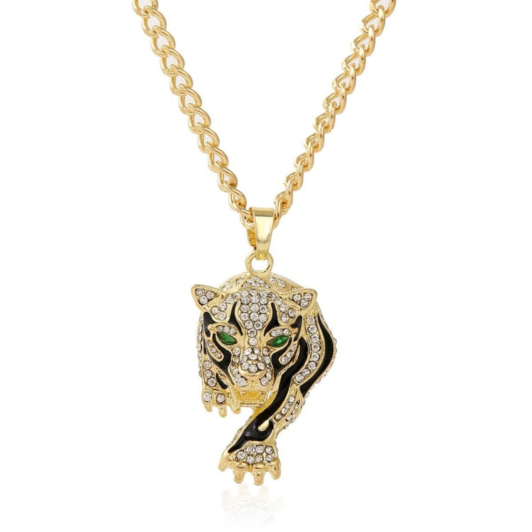 Gold-tone rhinestone chain necklace with lion head pendant and green accents