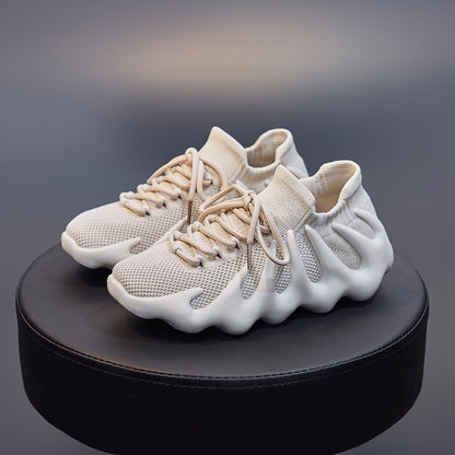 Beige knit sock shoes with mesh upper, lace-up front, and cushioned sole view