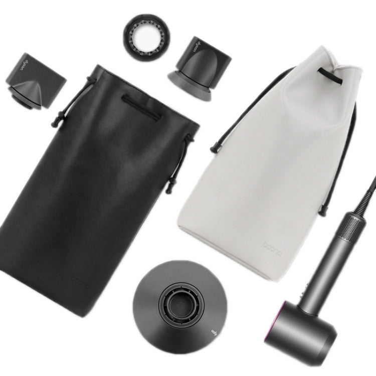 Hair dryer accessory storage set: black and white bags with multiple nozzle attachments.