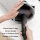 Open gray fleece-lined storage bag with hair dryer and nozzle being inserted.