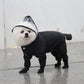Black four-leg pet raincoat with hood, snap buttons, and covered paws