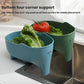 Blue elephant-shaped drain basket on sink with lettuce and anti-slip feet