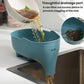 Blue elephant-shaped drain basket under faucet with flowing water and drainage openings
