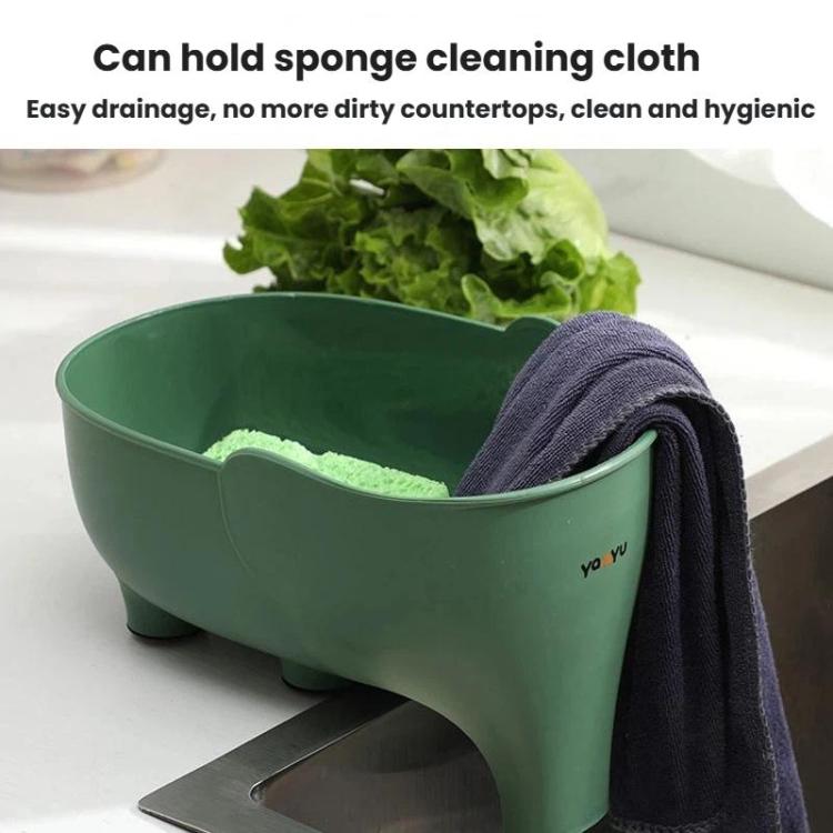 Green elephant-shaped drain basket holding lettuce with a folded dark cleaning cloth