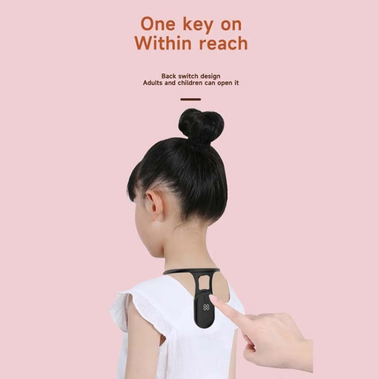 Black neck posture corrector on child with hair in a bun, side view