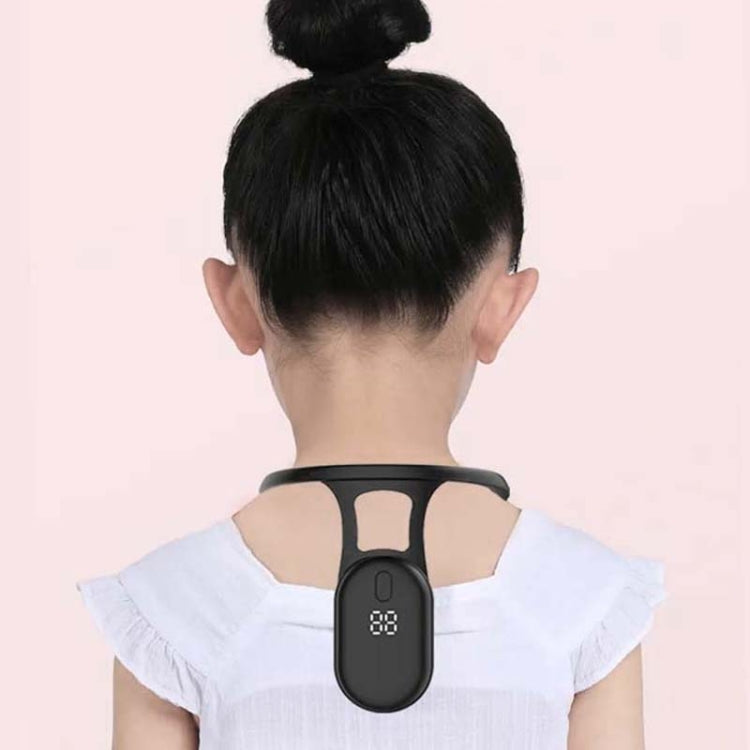 Black neck posture corrector with LCD display worn at the back of the neck