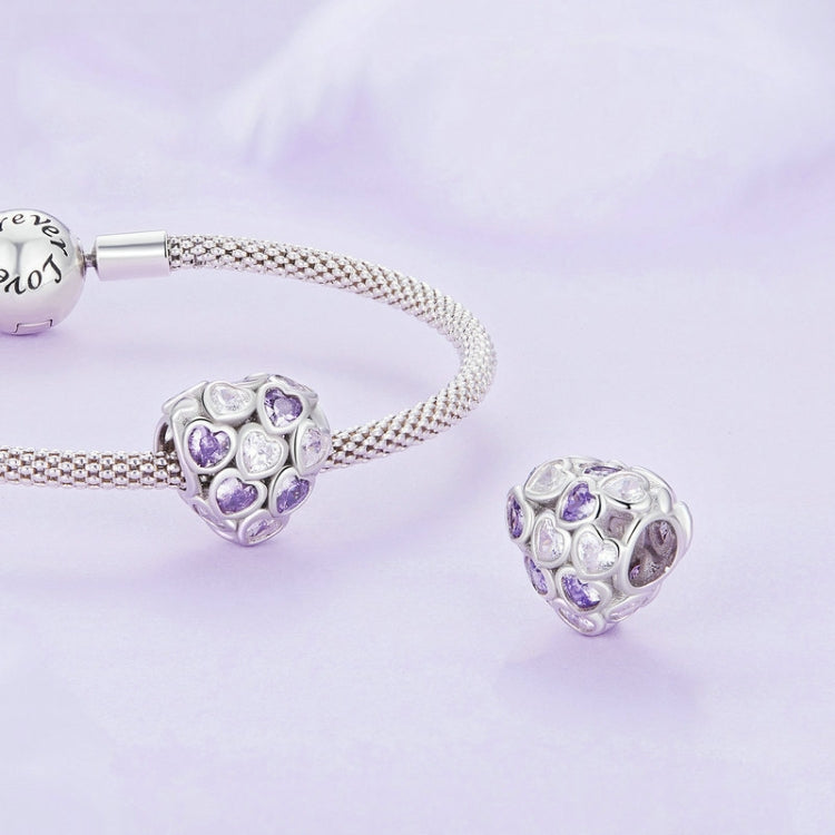 Mesh silver bracelet with heart-shaped zirconia charm featuring purple and clear stones