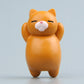 Orange cartoon cat resin fridge magnet, standing figure with pink nose and closed eyes.