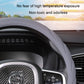 Gray steering wheel cover with textured grip over the wheel rim, close-up view