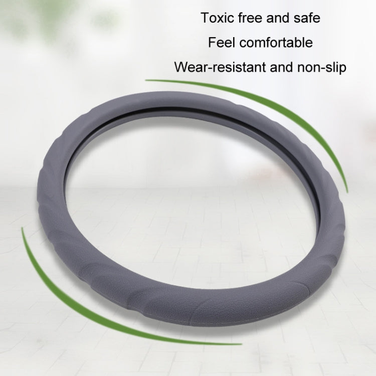 Gray silicone steering wheel cover with non-slip ring outline and cushioned edge