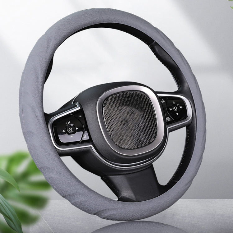 Gray silicone steering wheel cover with textured center panel and wrapped rim