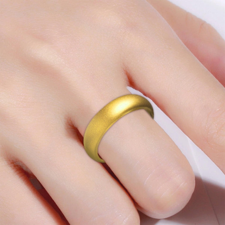 Matte gold wide silicone band ring on finger