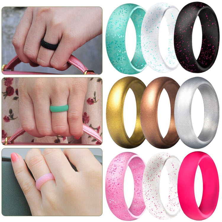 Glitter silicone wide couple rings in assorted colors on a hand