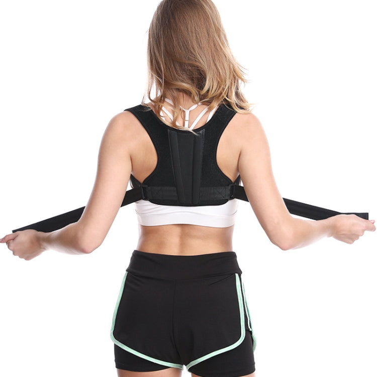 Back view of black posture corrector with center panel and wide adjustable back straps