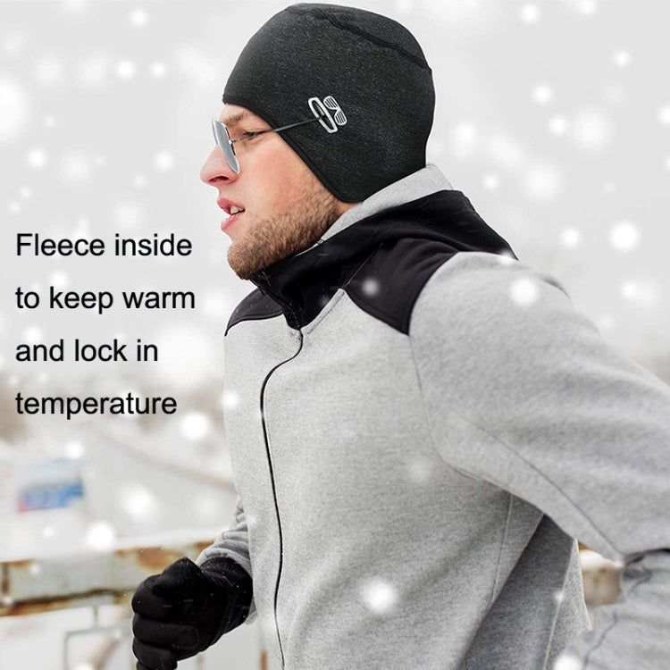Black knit winter skull cap with cactus logo and fleece lining, worn outdoors
