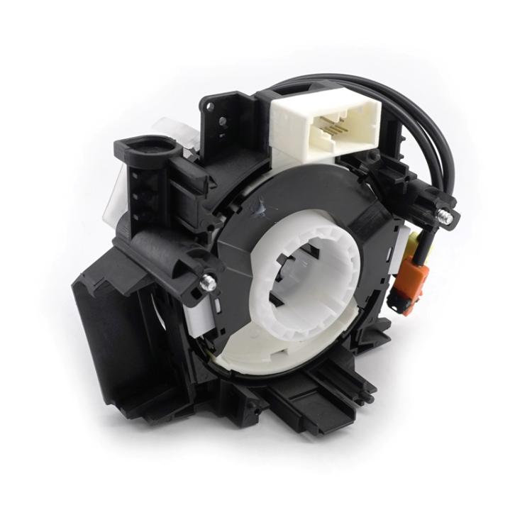Clock spring coil assembly with white center hub and black plastic housing