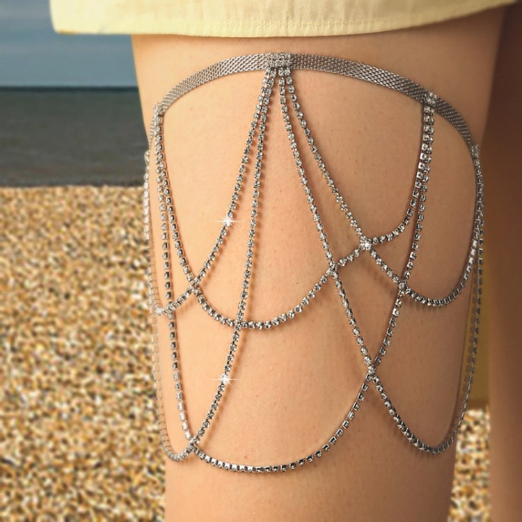 Silver layered thigh chain with multiple draped strands and central snake charm