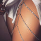 Silver layered thigh chain draped over leg with small sparkling bead links