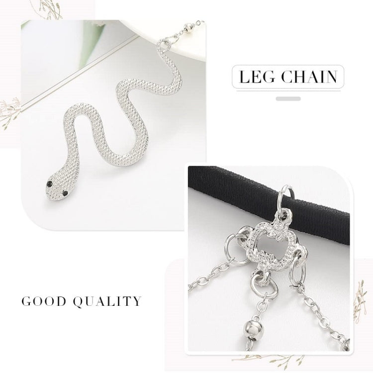 Silver leg chain with black band and snake-shaped charm, shown with packaged accessories