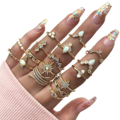Gold-tone boho alloy ring set with opal-like stones and star accents on hand