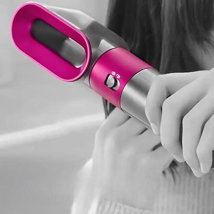 Pre-styling air nozzle attachment in use, magenta oval opening on hair dryer