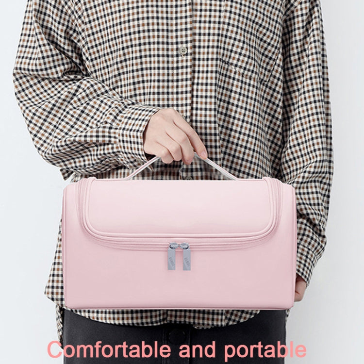 Pink portable hair tool storage bag with front zip pocket and top handle