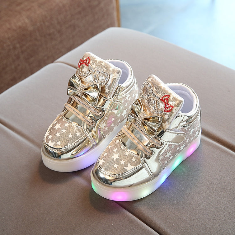 Kids flashing sneakers, metallic silver stars and bow ornament, white laces, glowing LED sole