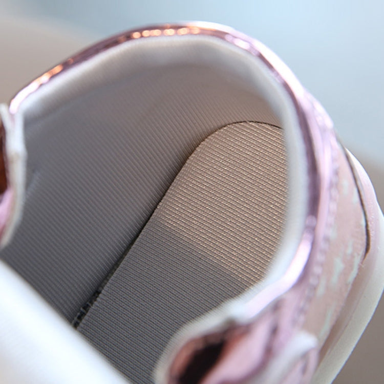Pink kids sneaker inner view with cushioned fabric lining and bright glowing light edge
