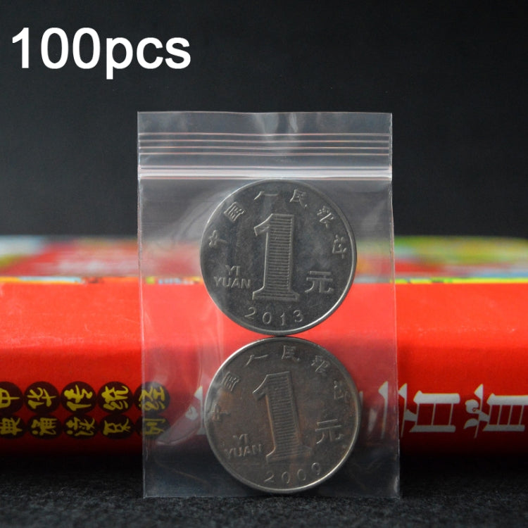 Clear perforated zip-top plastic bag with sealed top closure and two coins inside