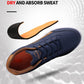 Men's navy leather sneakers with lace-up closure, tan lining, white rubber sole