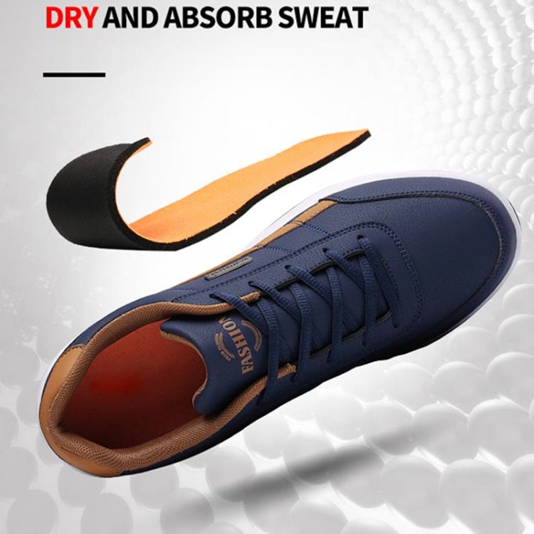 Men's navy leather sneakers with lace-up closure, tan lining, white rubber sole