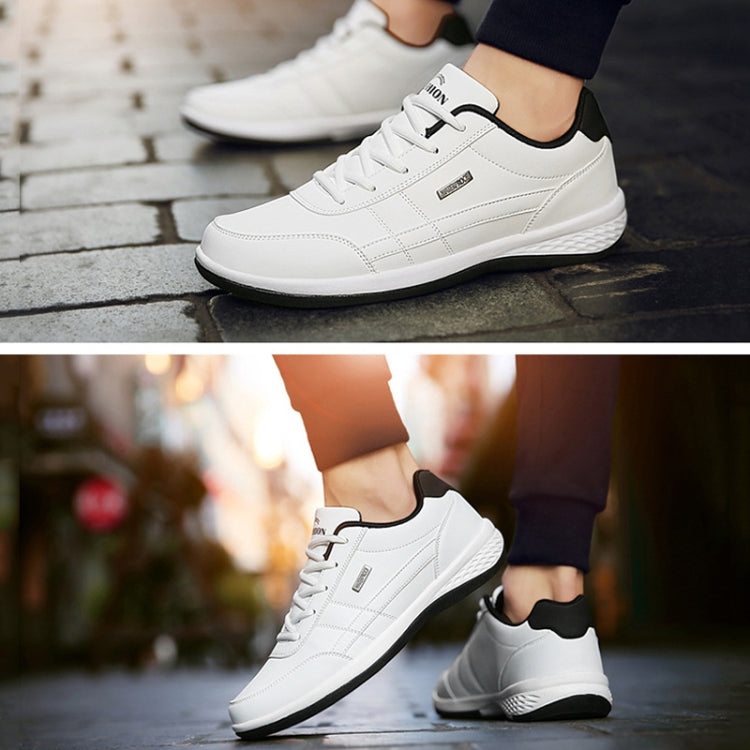 Men's white leather casual sneakers with lace-up front and black-trimmed sole