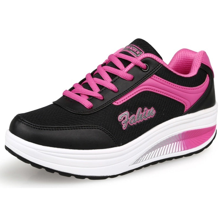 Black and pink lace-up women's sports sneaker with chunky white platform sole