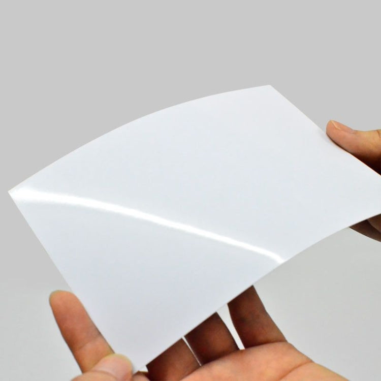 Glossy white photo paper sheet for 4R printing, held by hands
