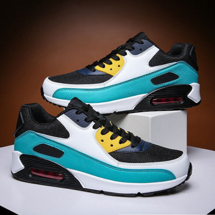 Turquoise air-cushion sneakers with white uppers, black lace-up design, and red air unit
