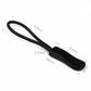 Black zipper cord puller with textured plastic slider tip and looped strap