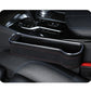Car seat gap storage box installed on seat side in dark fabric with red stitching